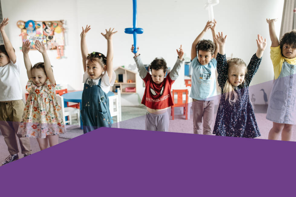 Seven children in a preschool classroom stretching and playing